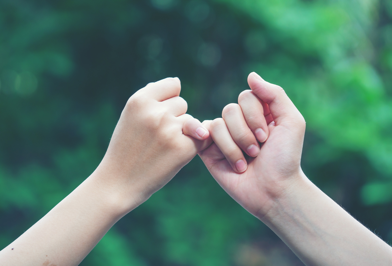 Hands with Pink Fingers Interlocked